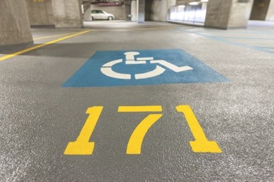 Coated parking garage deck with fresh stall markings